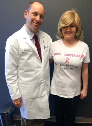 Dr. Deutsch posing with a patient