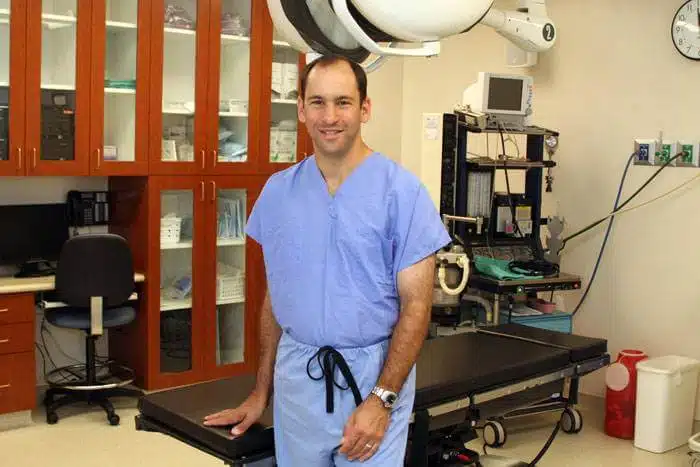 dr deutsch standing by operating table in procedure room