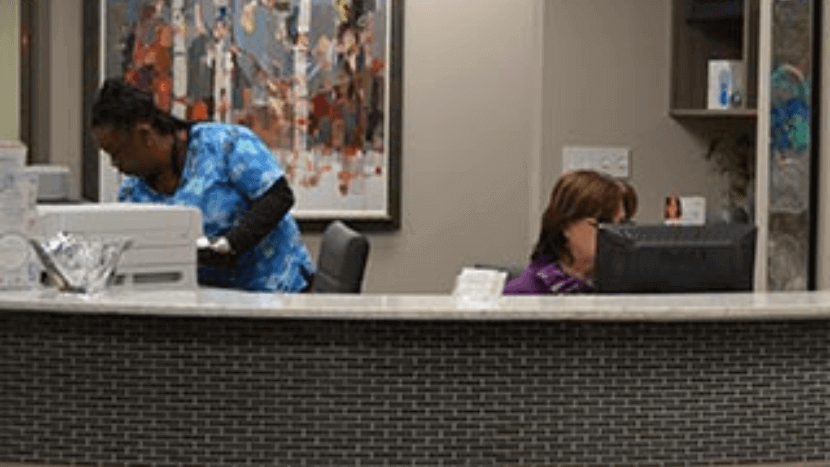 The perimeter plastic surgery front desk and the two staff.