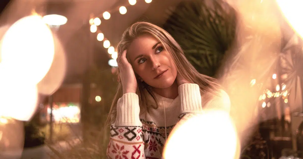 Woman smiling at a holiday party after Atlanta plastic surgery treatments