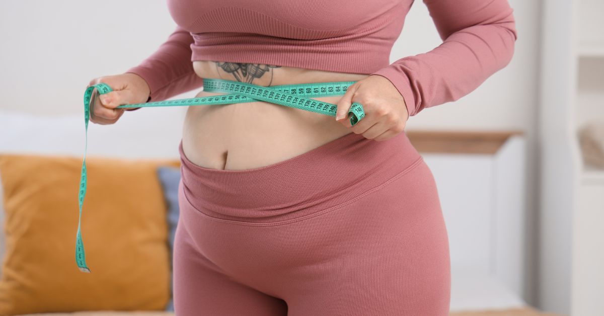 a woman needs tummy tuck plus-size woman getting checked for tummy tuck surgery in Atlanta